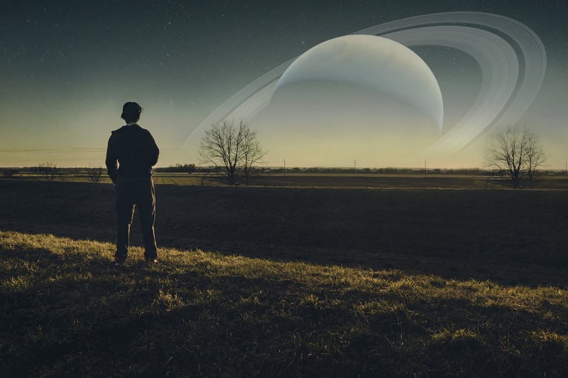 Saturn over Earth by VevericaStrela