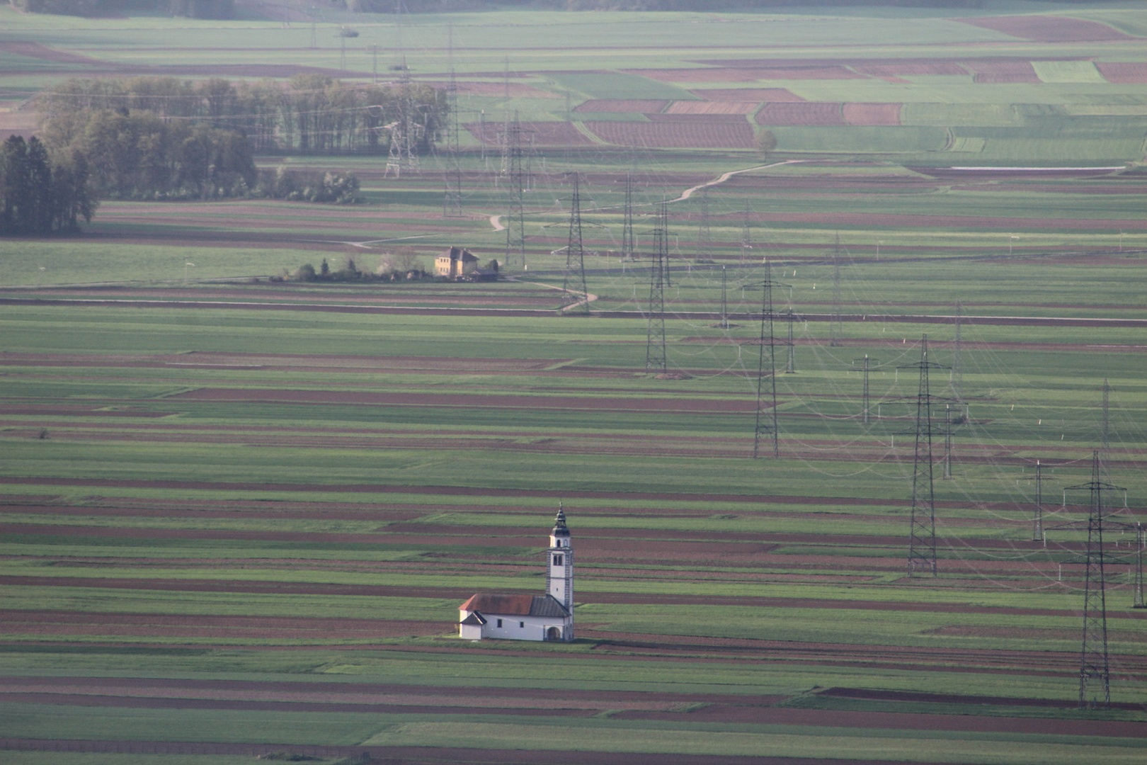 polje in cerkev by Janez Švab