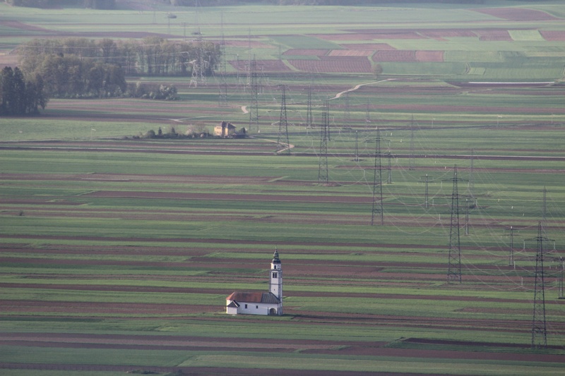 polje in cerkev by Janez Švab