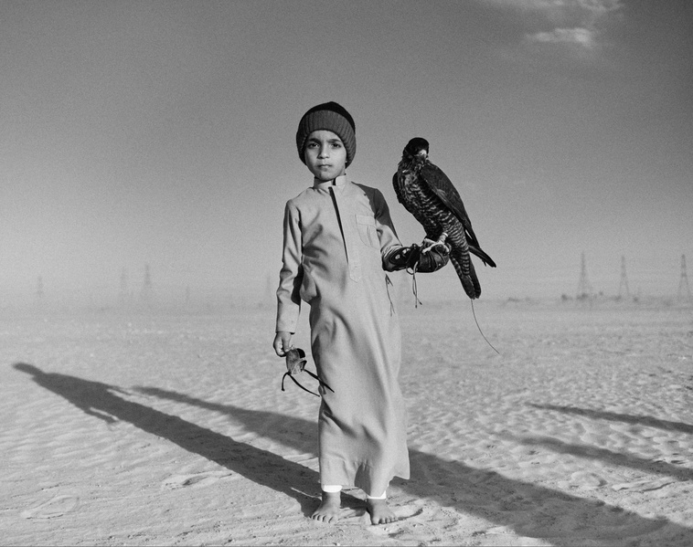 Emirati boy with his falcon by Žiga Mihelčič