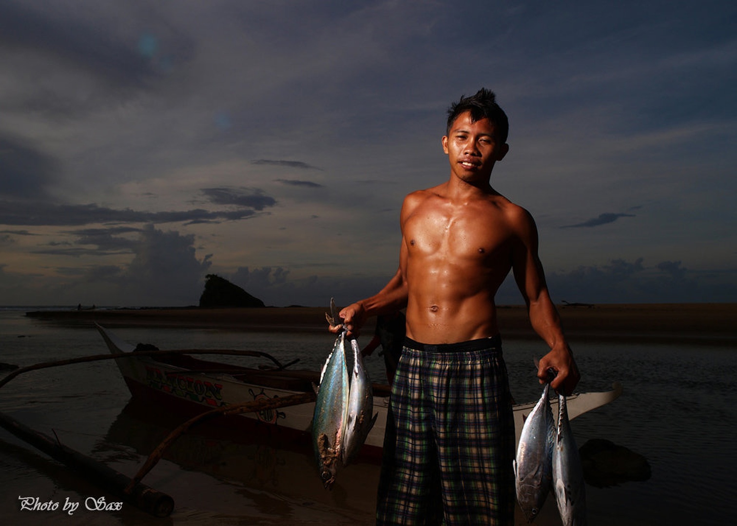 Young fisherman by saxy