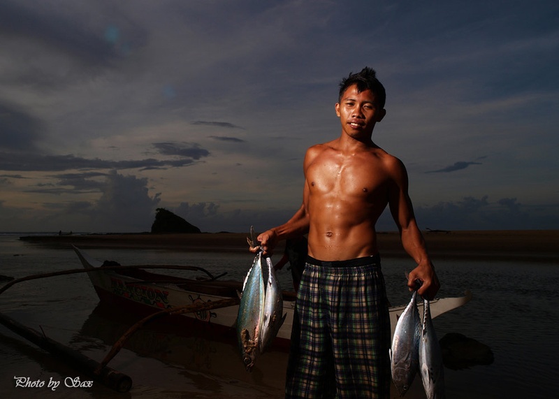 Young fisherman by saxy
