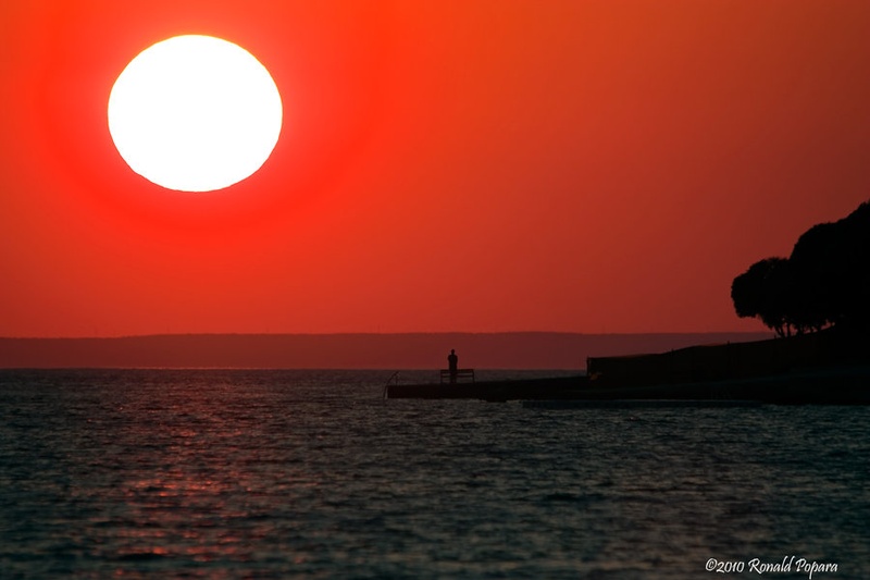 Alone at sunset by Ronald Popara