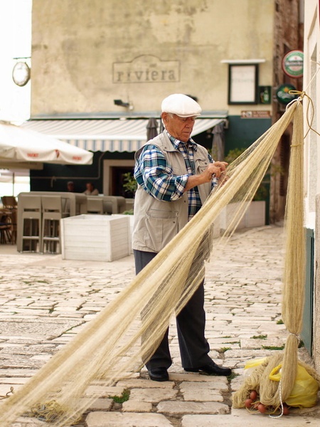 Old man and his net by Marko Buntic