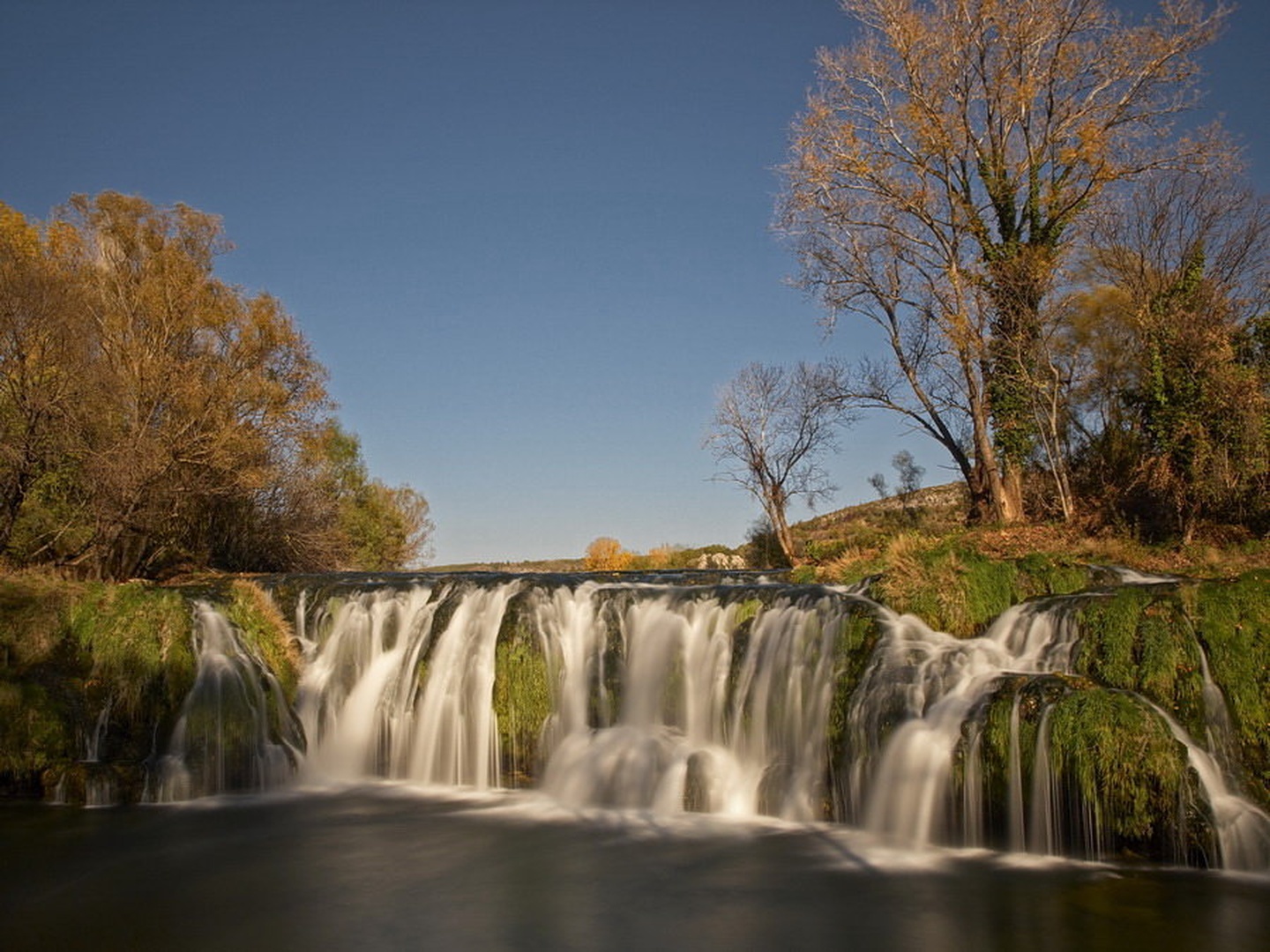 Autumn colors of an Waterfall by Marko Buntic