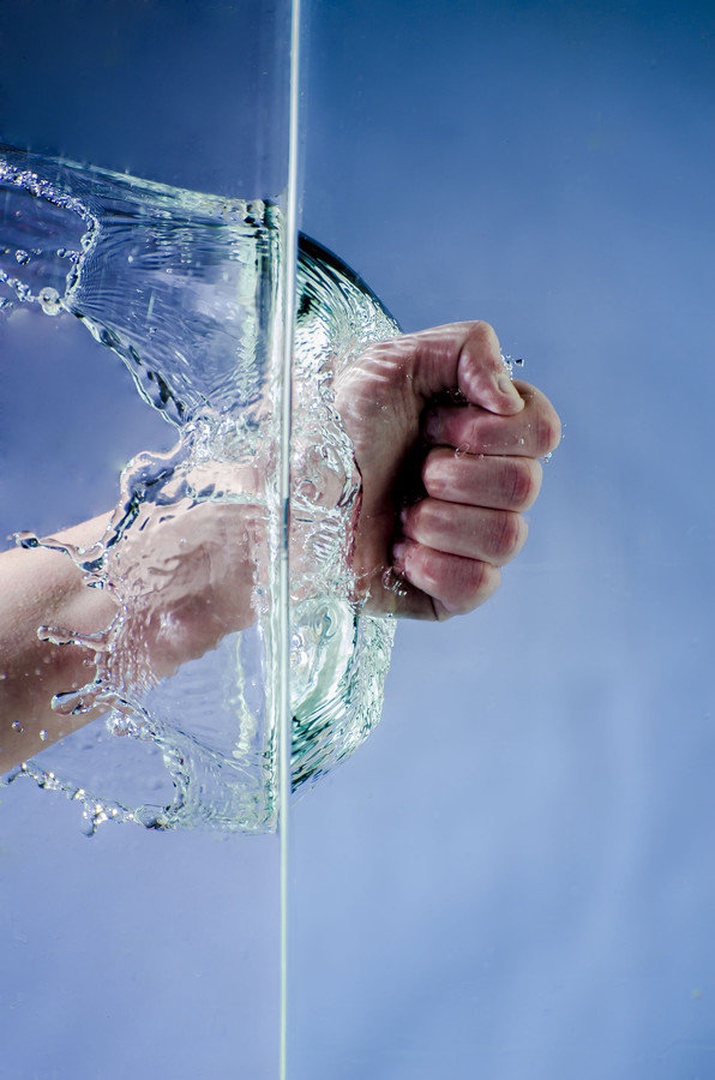 Hand through water by Emanuel Kovacic