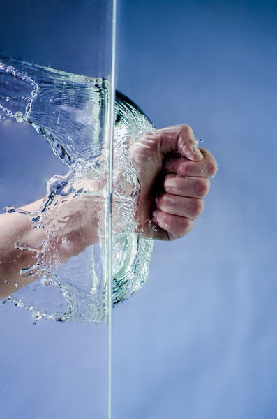 Hand through water by Emanuel Kovacic